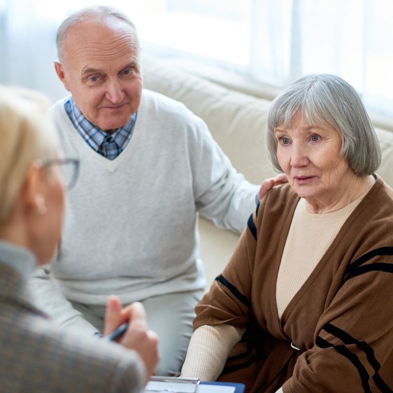 Elderly couple listening to therapist